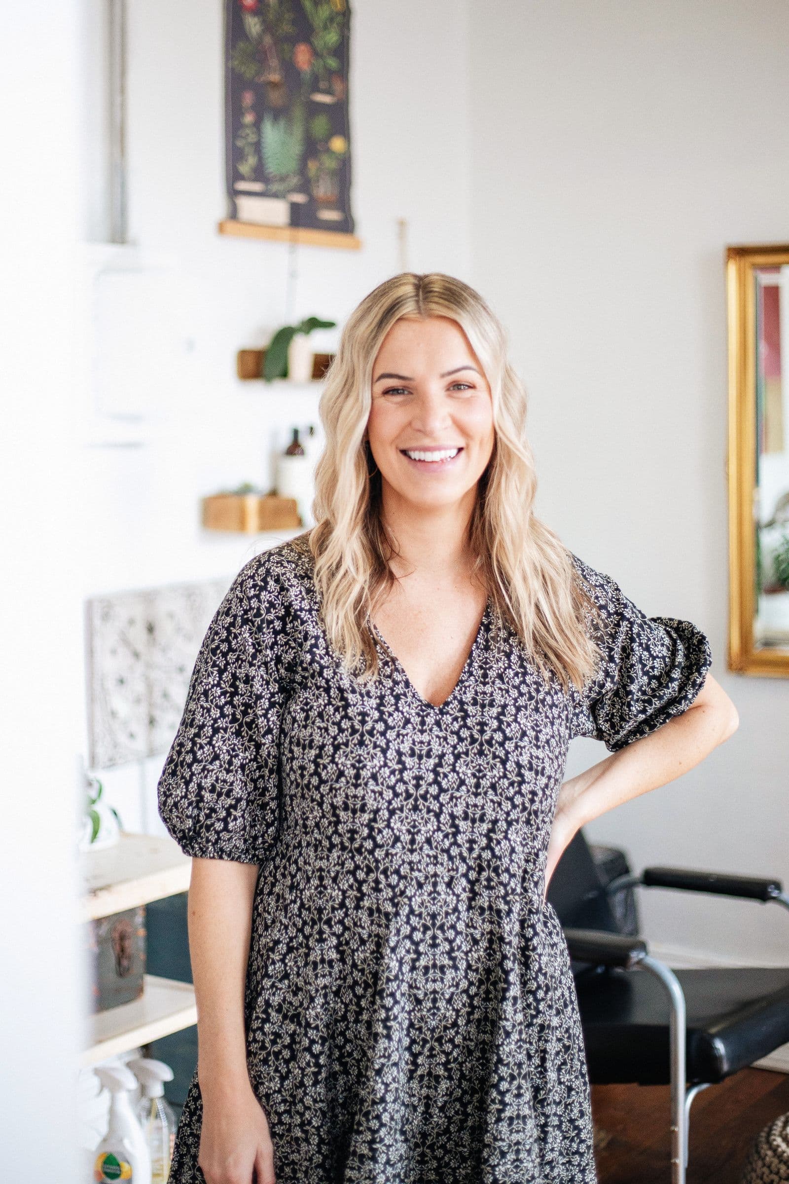 Salon owner smiling in her studio